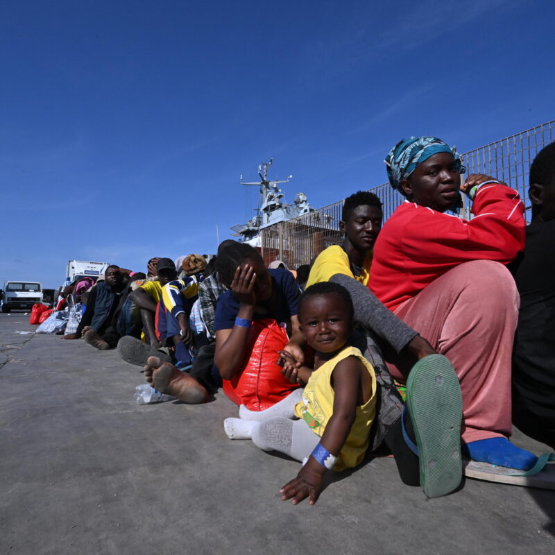 Hundreds of migrants wait in line at the port pier to be boarded on the military ship Cassiopea and transferred to other places from the island of Lampedusa, southern Italy, 15 September 2023.A record number of migrants and refugees have arrived on the Italian island of Lampedusa in recent days. Lampedusa's city council declared a state of emergency on 13 September evening after a 48-hour continuous influx of migrants. In the morning of September 14, nearly 7,000 migrants were on the island. ANSA/CIRO FUSCO