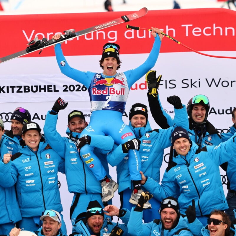 epa12677307 First placed Giovanni Franzoni of Italy and his team pose on the podium after the Men's Downhill race at the FIS Alpine Skiing World Cup in Kitzbuehel, Austria, 24 January 2026. EPA/ANNA SZILAGYI